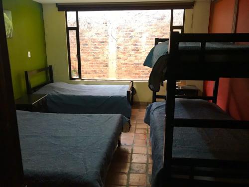Ein Bett oder Betten in einem Zimmer der Unterkunft Cabaña Huitaca