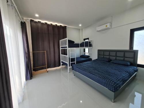 Ένα ή περισσότερα κρεβάτια σε δωμάτιο στο Kazokupoolvilla