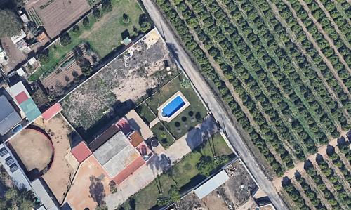 an overhead view of a field with a car in it at Villa Dársena in Seville