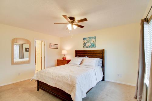 a bedroom with a bed and a ceiling fan at Comfy Albuquerque Townhome Less Than 6 Mi to Downtown in Albuquerque