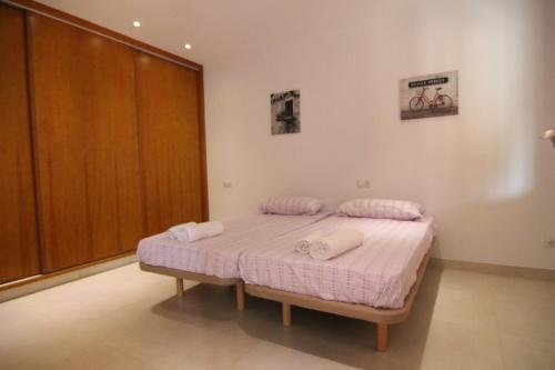 Katil atau katil-katil dalam bilik di Casa en Establiments
