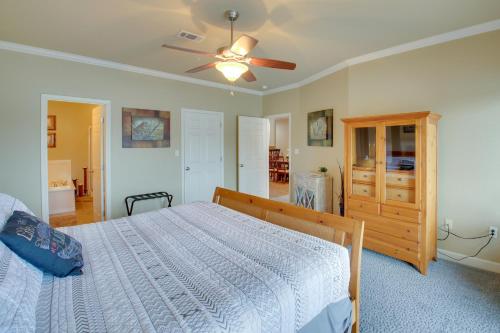 a bedroom with a bed and a ceiling fan at Hot Springs Condo on Lake Hamilton with Pool Access in Hot Springs