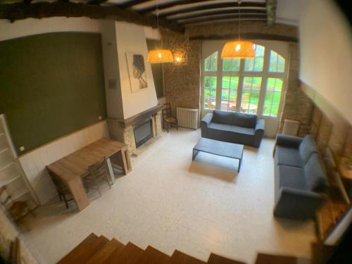 an overhead view of a living room with couches and a chalkboard at Gite de la Renardière in Paunat