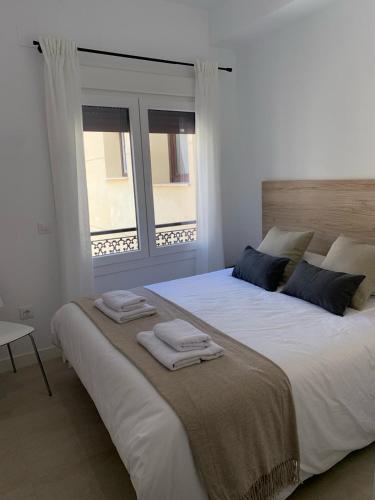 La Vega de San Torcuato - 3 HABITACIONES DOBLESにあるベッド