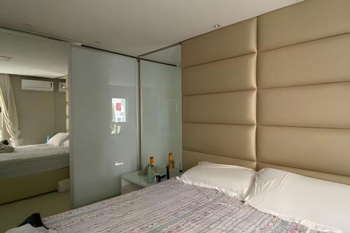 Llit o llits en una habitació de Ampla casa com piscina na Pituba