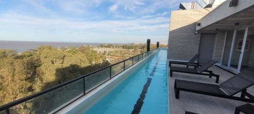 a swimming pool on the balcony of a house at Monoambiente c/vista al río-pax3 in Olivos