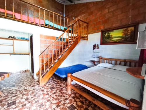 Ένα ή περισσότερα κρεβάτια σε δωμάτιο στο Hotel Arqueológico San Agustín