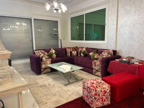 a living room with a couch and a table at La Perla Montaña Tanger in Tangier