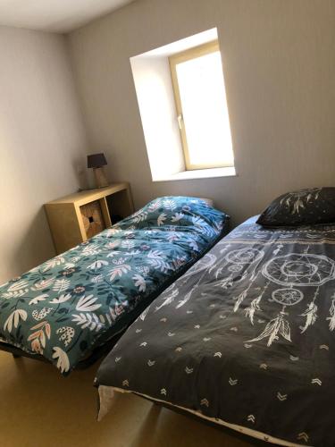 Appartement centre ville Langres tesisinde bir odada yatak veya yataklar