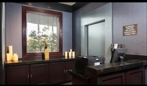 a office with a counter with a window and a fax at Apartment with Balcony at Platinum Hotel in Las Vegas
