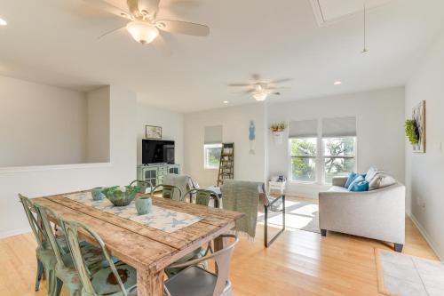 a dining room and living room with a table and chairs at Seabrook Getaway with Balconies and Bay Views! in Seabrook