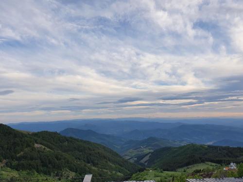 a view of a valley with mountains in the distance at Marrilux apartments Residence Hill in Kopaonik