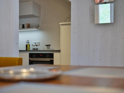 a kitchen with a table with a plate on it at Haus Fünf mit 2 Apartments und Studio-Loft mit Terrasse in Melk