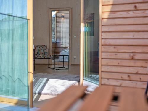 a view of a living room with a glass door at Haus Fünf mit 2 Apartments und Studio-Loft mit Terrasse in Melk