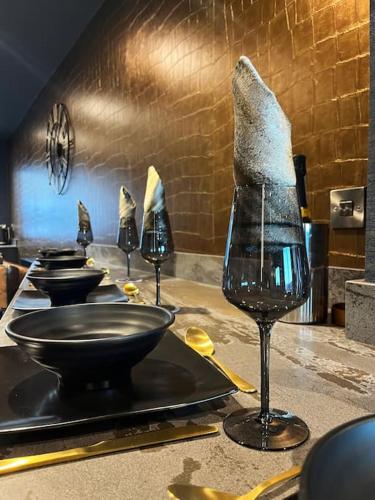 a group of wine glasses sitting on a counter at Highlights Views, Overlooking Mouth of the Tyne in Tynemouth
