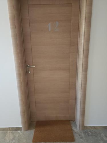 a door with the number on it at Riva i Lido Srebrno jezero in Veliko Gradište
