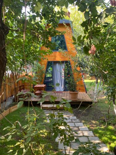 a tiny house in the middle of a garden at Eco in Yerevan