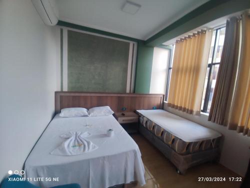 En eller flere senge i et værelse på casa sol residencial tarapoto