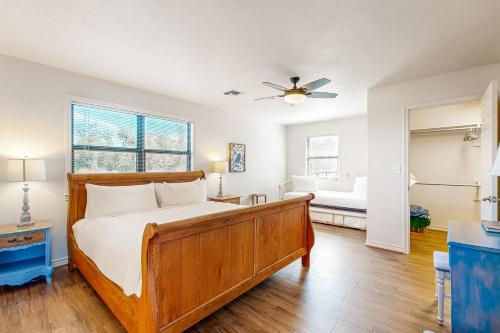 a bedroom with a bed and a ceiling fan at Casa Austin in Fredericksburg