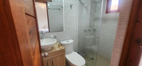 a bathroom with a toilet and a sink and a shower at Hotel Villa Javier VDL in Villa de Leyva