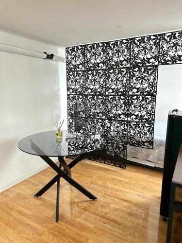 a glass table in front of a black and white wall at Dolce vita Florence room in Florence