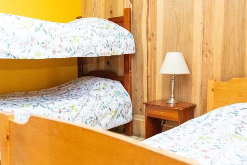 Postel nebo postele na pokoji v ubytování Cabañas el Dorado Pucón