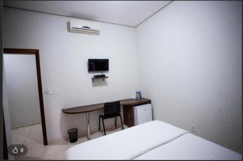 Giường trong phòng chung tại Paineiras Park Hotel