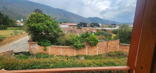 a view of a town with a brick wall at Hotel Villa Javier VDL in Villa de Leyva
