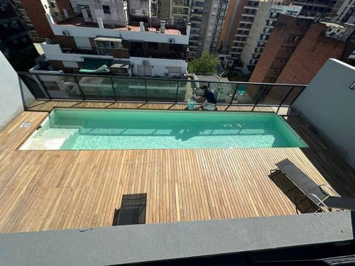 a swimming pool on the roof of a building at Departamento en Belgrano Capital Federal in Buenos Aires