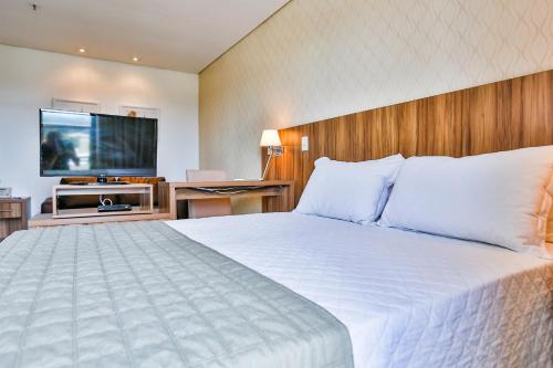 Ένα ή περισσότερα κρεβάτια σε δωμάτιο στο MG Flats & Residence