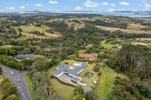 an aerial view of a house with a road at Countryside Haven Retreat with Pool and Deck in Clevedon