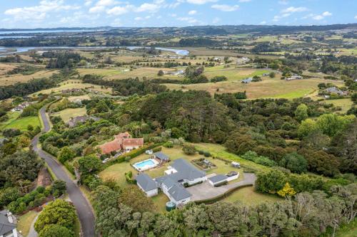 an aerial view of a large house with a driveway at Countryside Haven Retreat with Pool and Deck in Clevedon