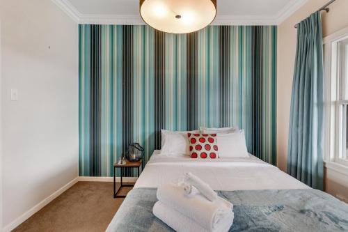 a bedroom with a bed with two towels on it at Countryside Haven Retreat with Pool and Deck in Clevedon