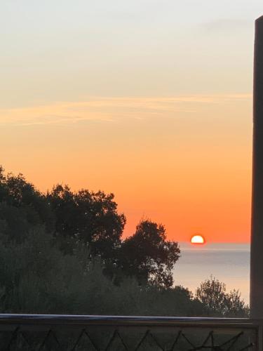 a sunset seen from the window of a house at Villa Libecciu in Sainte-Lucie de Porto-Vecchio