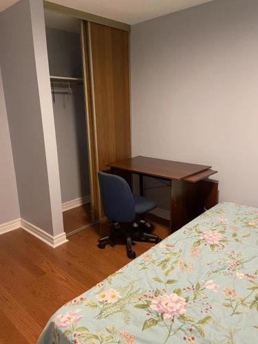 a bedroom with a desk and a bed and a chair at Aiyifan12138 in Waterloo
