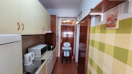 a small bathroom with a toilet in a room at Soleil Central Apartments in Skopje
