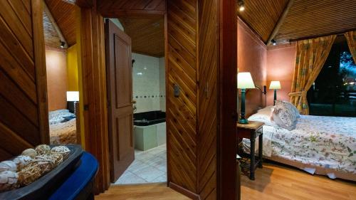 Postel nebo postele na pokoji v ubytování Cabañas el Dorado Pucón