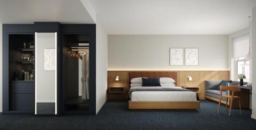 Un pat sau paturi într-o cameră la Hotel AKA Back Bay