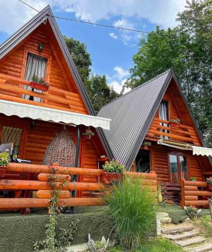 a log cabin with a metal roof at Konak kod Tose in Banja Luka