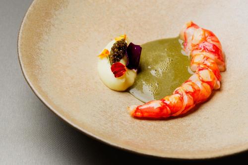 a plate of food with shrimp and sauce on it at The Ritz-Carlton Tenerife, Abama in Guía de Isora