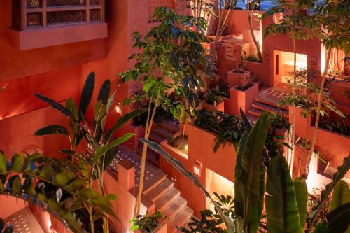 an orange building with plants on the side of it at The Ritz-Carlton Tenerife, Abama in Guía de Isora