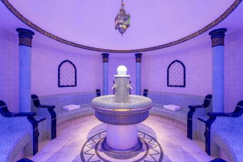 a room with a statue in the middle of a room at The Ritz-Carlton Tenerife, Abama in Guía de Isora