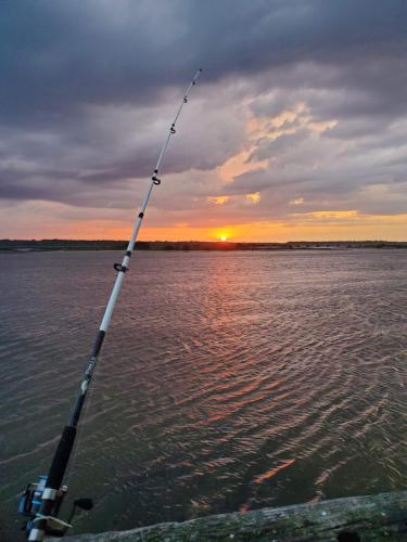 a rod on the end of a boat in the water at A1A Brownwaves in Saint Augustine
