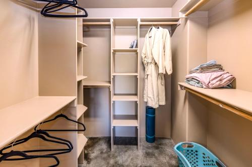 a walk in closet with white shelves at Cozy Cactus Inn in Sedona