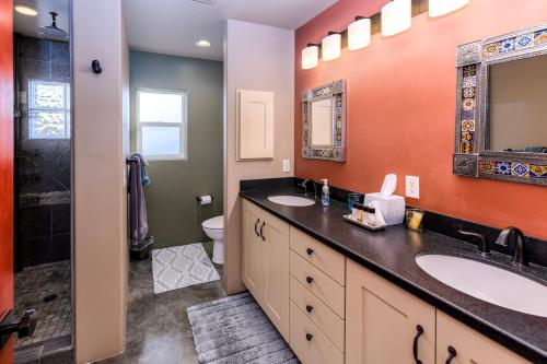 a bathroom with two sinks and a shower at Cozy Cactus Inn in Sedona
