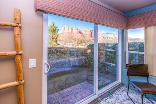a room with a window with a view of the canyon at Cozy Cactus Inn in Sedona
