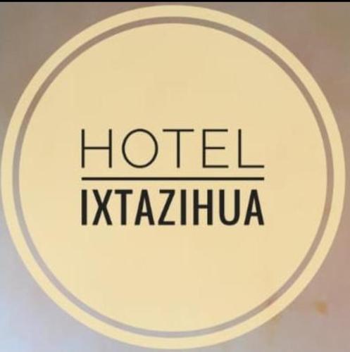 a white frisbee with the words hotel kittinia at Hotel Ixtazihua JP in Zihuatanejo