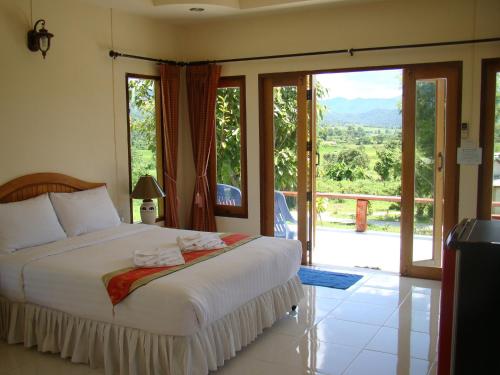 Postel nebo postele na pokoji v ubytování Pai Iyara Resort