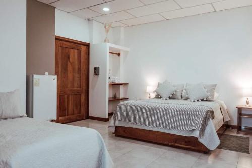 Postel nebo postele na pokoji v ubytování HOTEL AYRE By Baltra