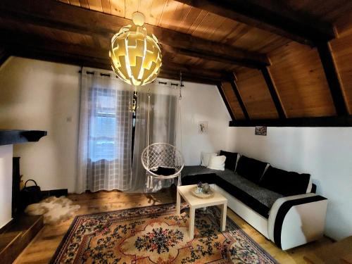 a living room with a couch and a table at Tarski vrh in Bajina Bašta